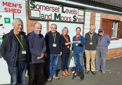 Mayor Kathy Pearce hands over the Showmen's Guild donation to Bridgwater Men's Shed