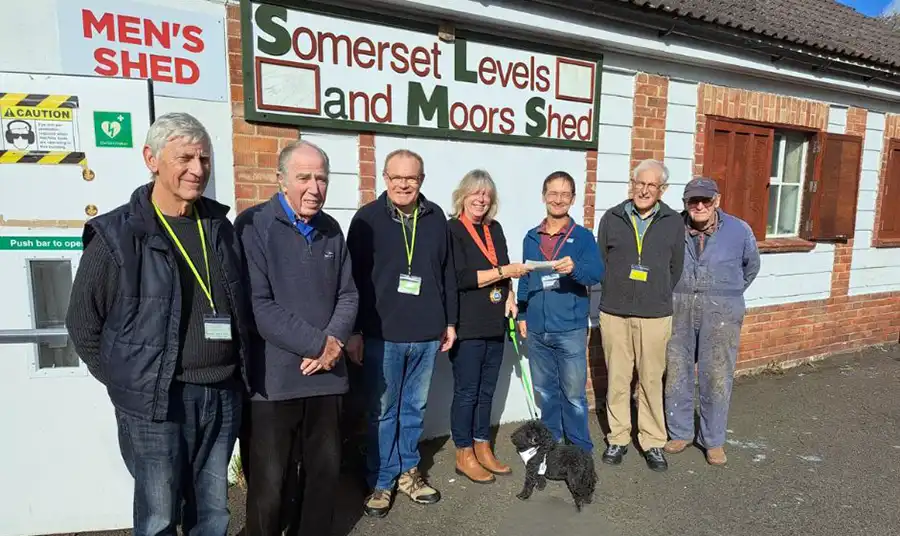 Mayor Kathy Pearce hands over the Showmen's Guild donation to Bridgwater Men's Shed