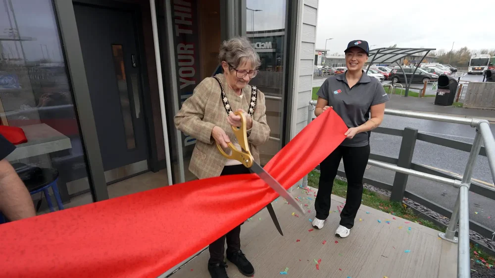 Mayor of Wellington, Janet Lloyd, does the honours at the new Domino's