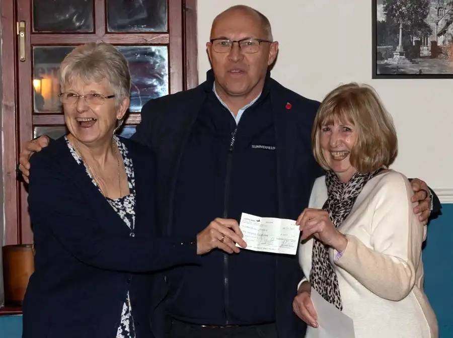 Summerfield MD handing over a £1,000 donation to Christmas Sparkle