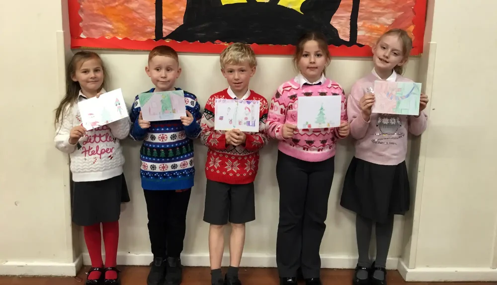 Pupils with the cards they designed for older residents in Wincanton