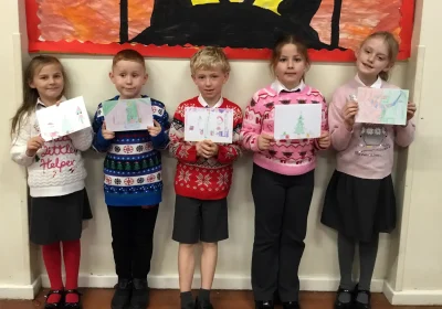Pupils with the cards they designed for older residents in Wincanton