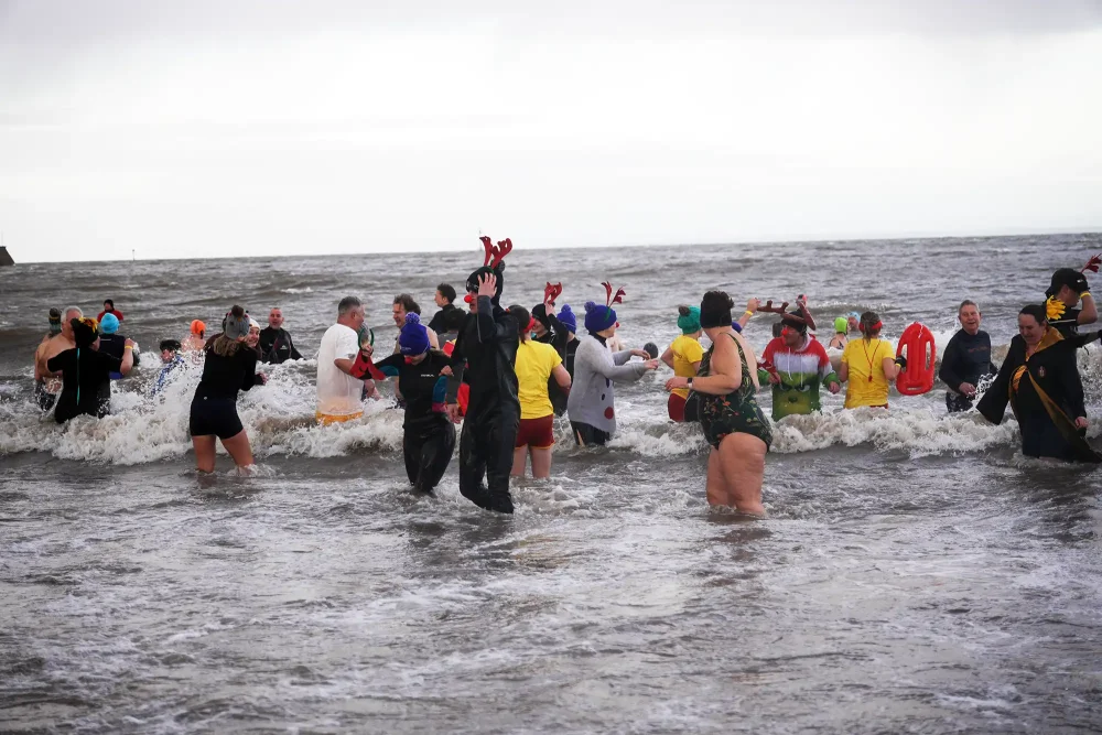 More than 100 swimmers took to the waters off Minehead Beach in aid of St Margaret's Hospice