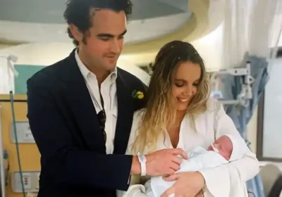 Archie and Issy with baby Lucky on their wedding day. Picture: Ferris & Sylvester