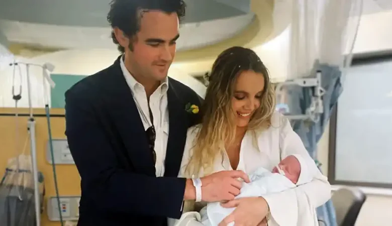 Archie and Issy with baby Lucky on their wedding day. Picture: Ferris & Sylvester