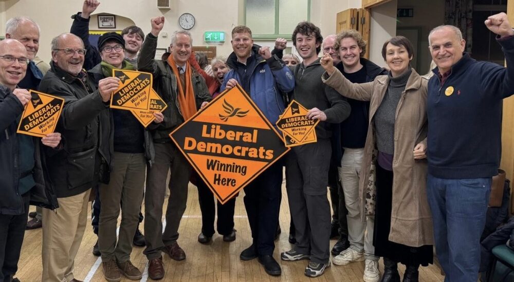 Lib Dems, including MP Gideon Amos and new councillor George Western, celebrate the wun in Wellington