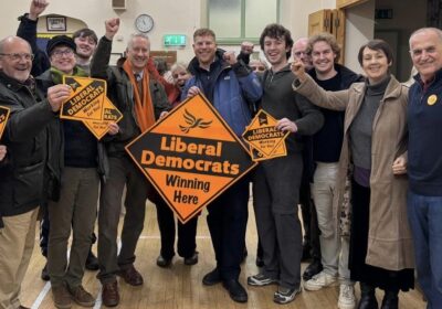 Lib Dems, including MP Gideon Amos and new councillor George Western, celebrate the wun in Wellington