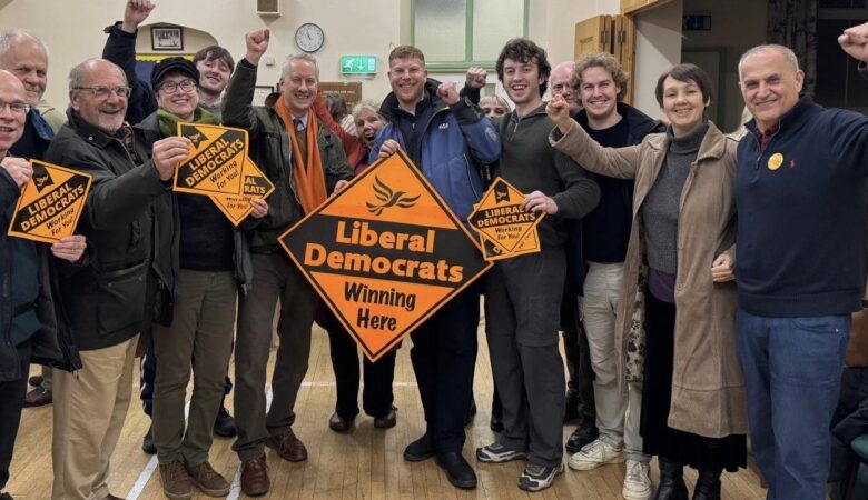 Lib Dems, including MP Gideon Amos and new councillor George Western, celebrate the wun in Wellington
