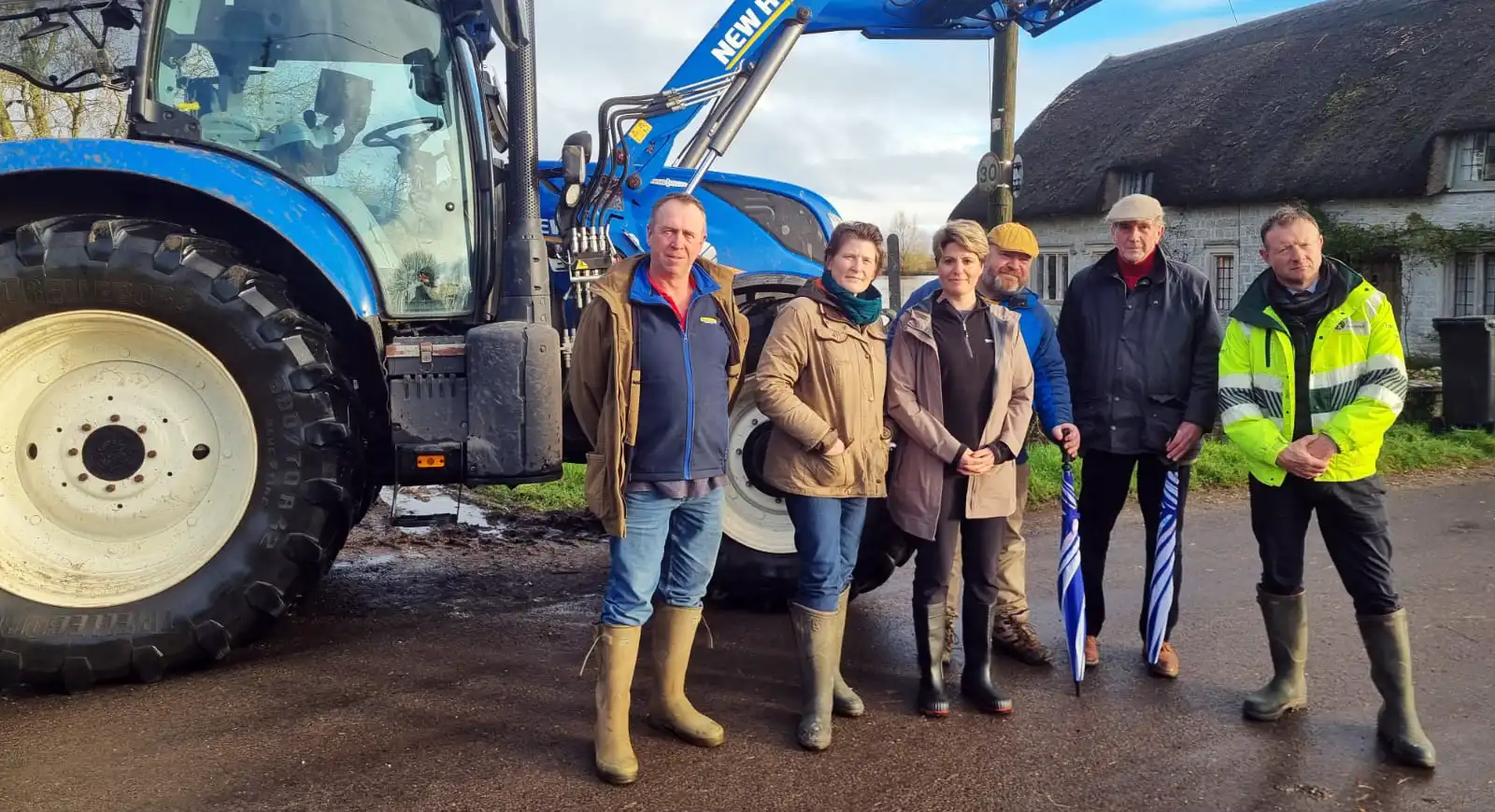 MP Sarah Dyke, Flooding Minister Emma Hardy and Somerset residents in Muchelney