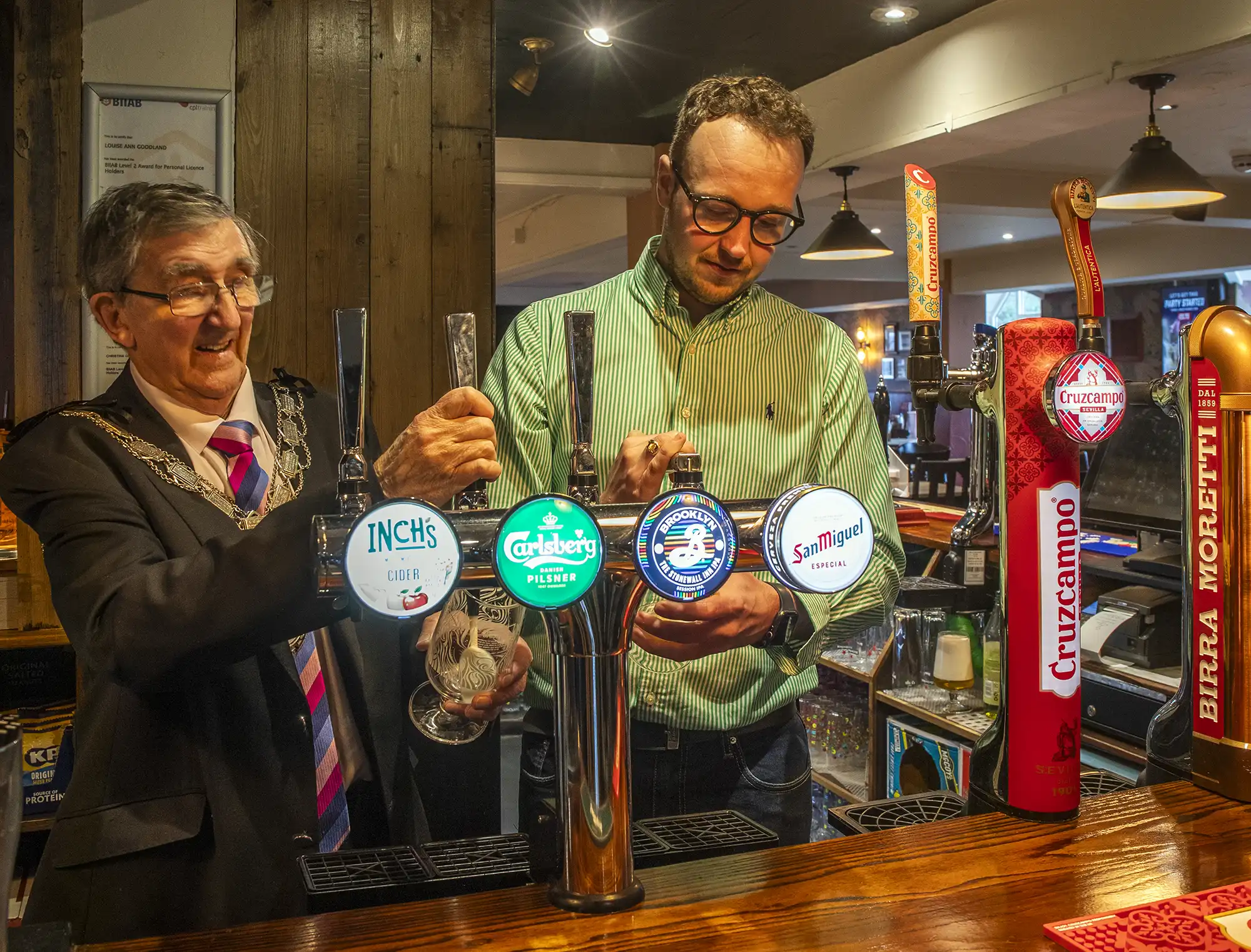 Mayor of Yeovil Tony Lock and MP Adam Dance pulling the first pints at The Arrow, in Yeovil, after a refurb