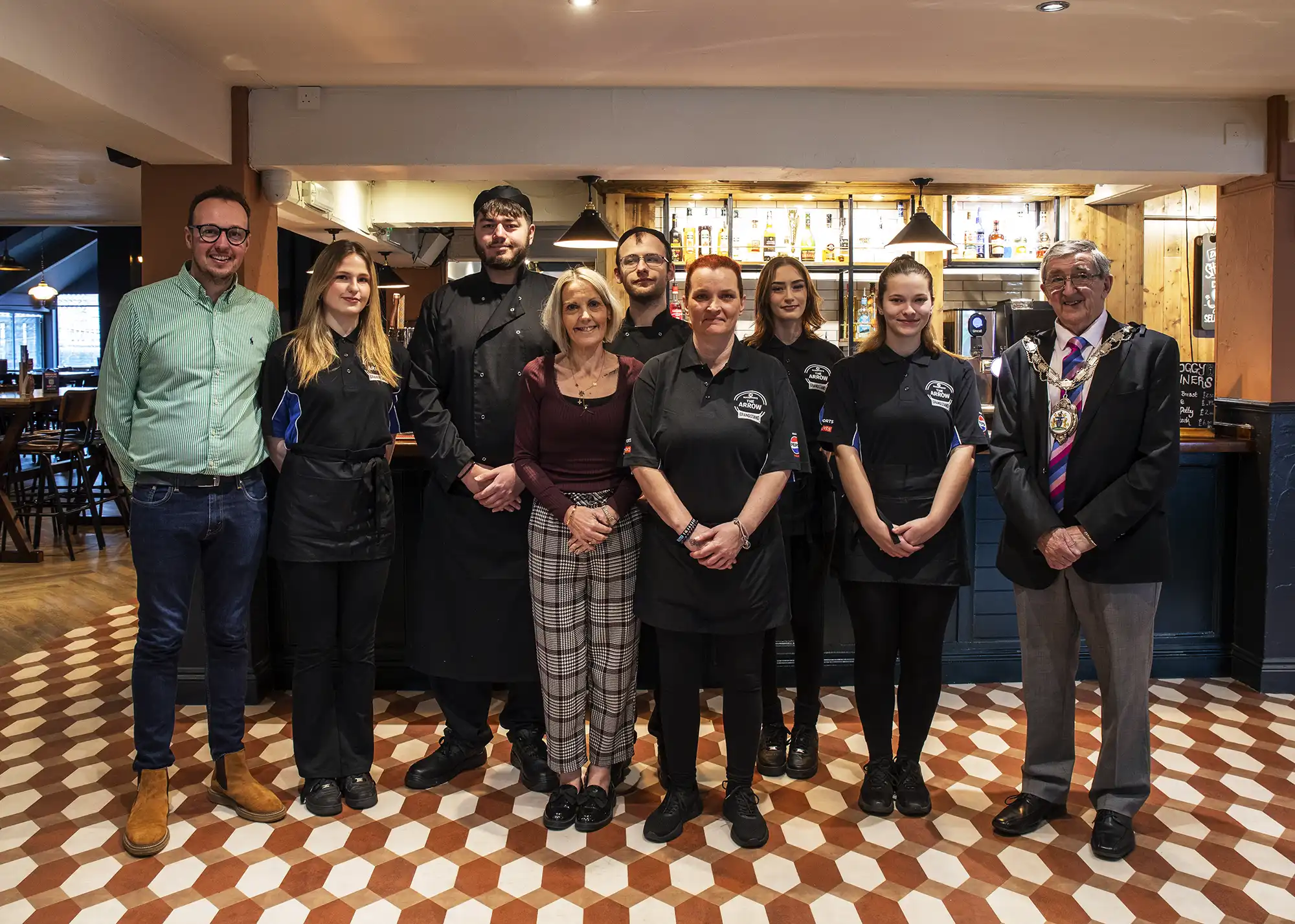 Mayor of Yeovil Tony Lock and MP Adam Dance with staff at The Arrow, in Yeovil