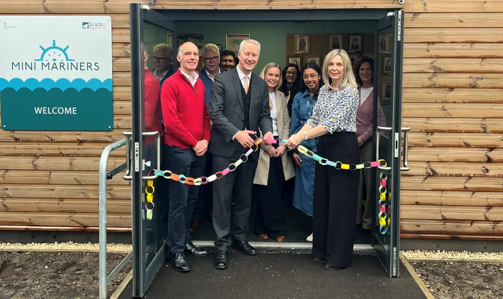 Taunton MP Gideon Amos does the honours at the expanded UKHO nursery, alongside chief executive Vanessa Blake