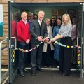 Taunton MP Gideon Amos does the honours at the expanded UKHO nursery, alongside chief executive Vanessa Blake
