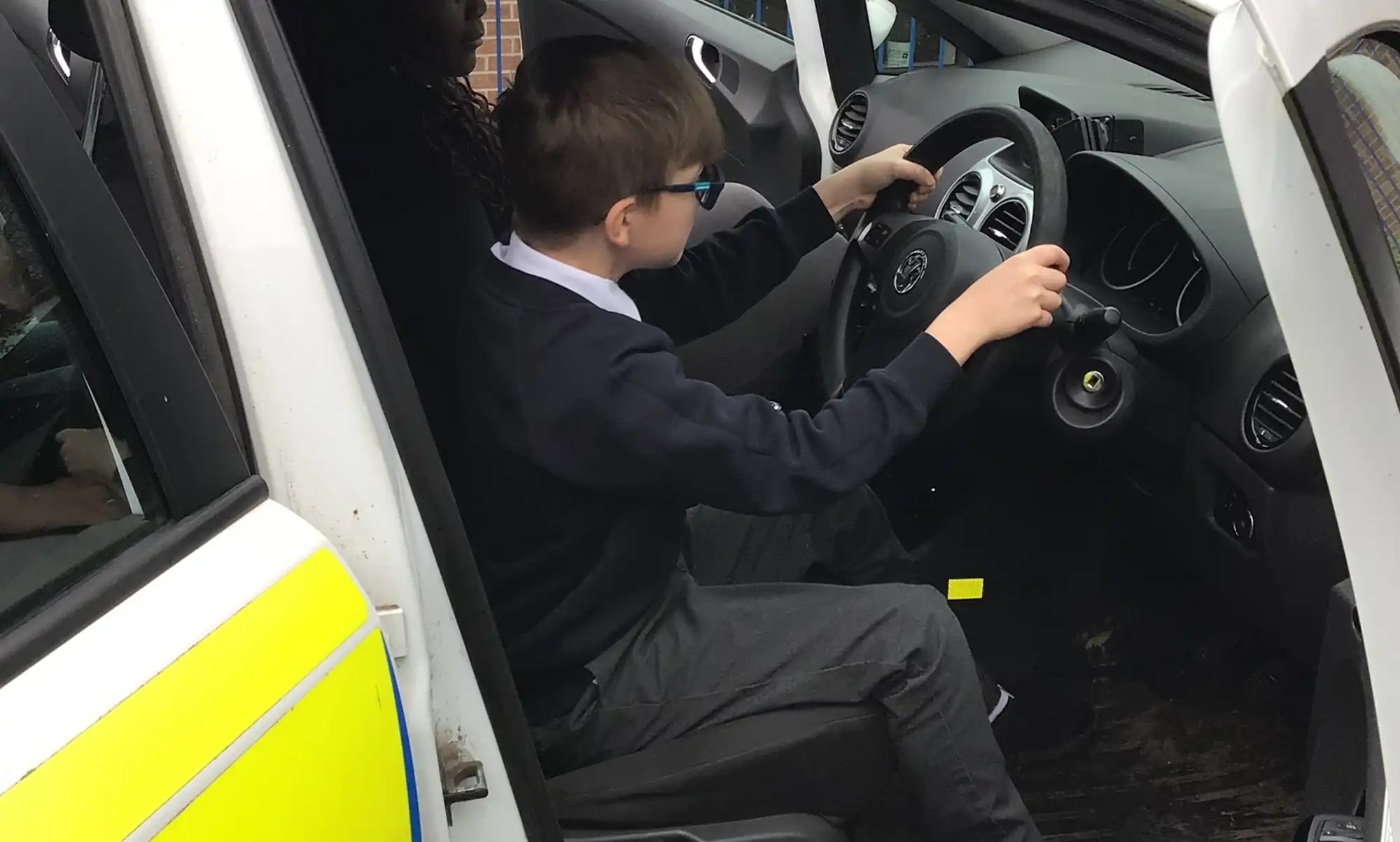 Getting behind the wheel of a police car
