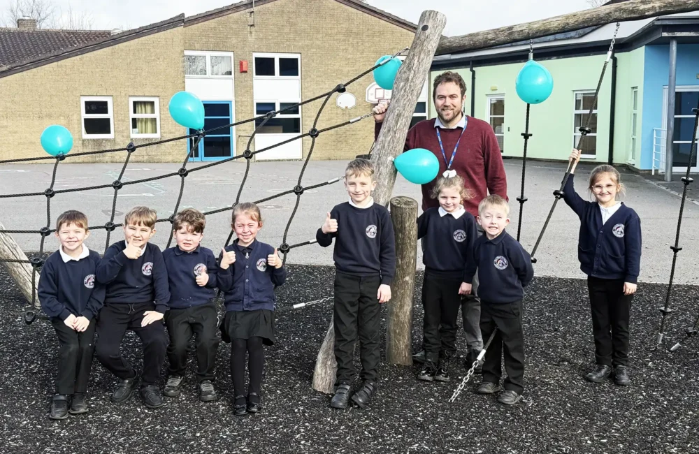 Executive headteacher at Christ Church First School in Frome with pupils