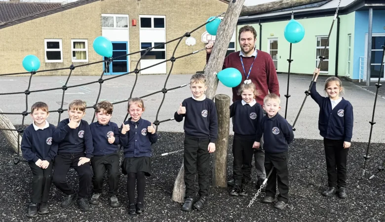 Executive headteacher at Christ Church First School in Frome with pupils